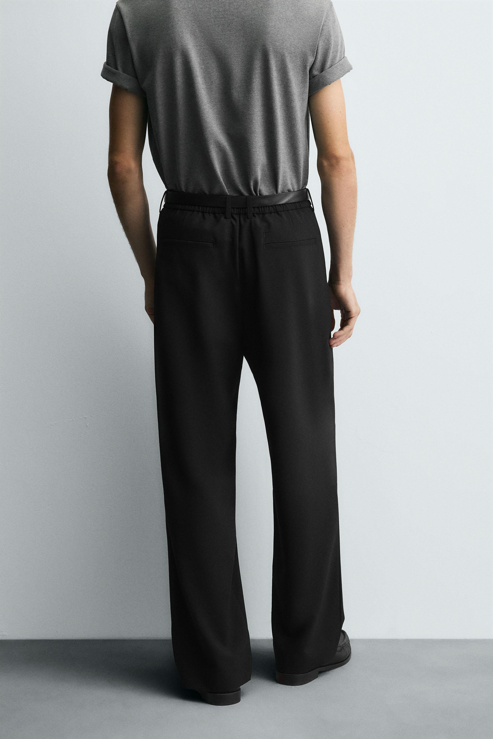 WIDE FIT PLEATED PANTS
